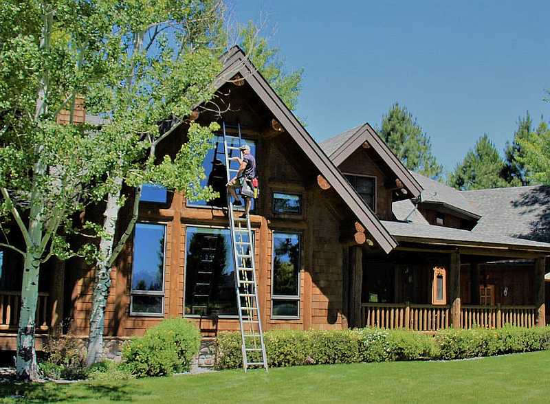 Log home window cleaning by Purity Montana